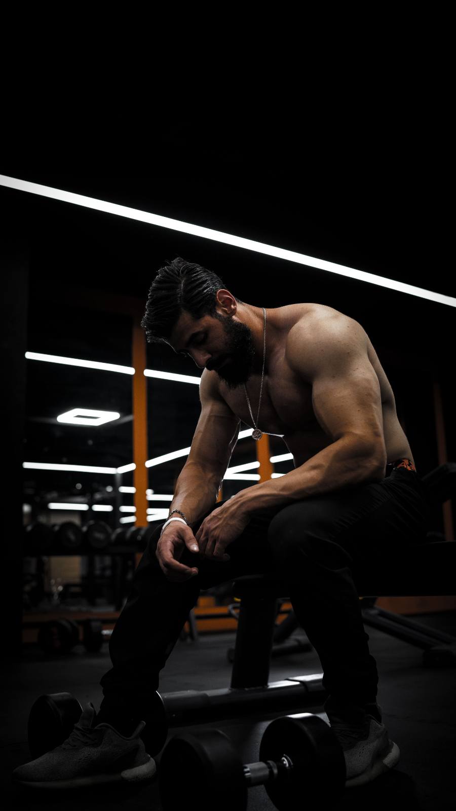 Athlete resting between sets in the gym